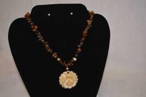 lot 198 image: Tiger Eye gemstone chip bead necklace with artisan carved bone pendant in flower form. Necklace 16L