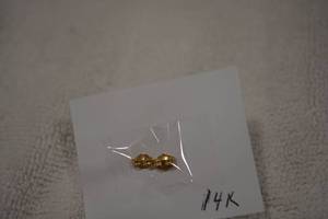 lot 194 image: 14K yellow gold poststud butterfly backs (Marked 14K on both)