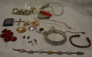 lot 222 image: Bag of miscellaneous single earrings, bone or ivory Fender guitar pick, parts, findings, plus