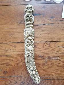 lot 5 image: Skeleton themed knife and sheath