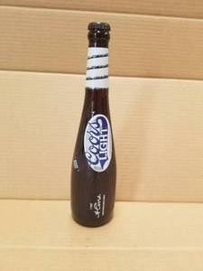 lot 80 image: Coor lite collectible unopened bat shaped beer bottle