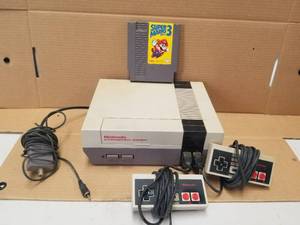 lot 159 image: Nintendo video game system with Super Mario 3 game