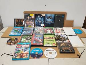 lot 185 image: Selection of DVDs and video games