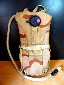 lot 99 image: ORIGINAL CAMELBAK HYDRATION PACK - CAMO THEMED