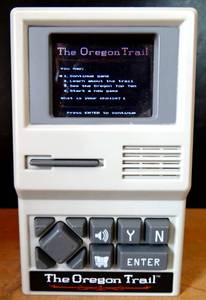 lot 100 image: Oregon Trail Handheld Electronic Game - TESTEDWORKS