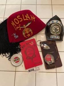 lot 32 image: CareerFrat Items - Shriner Hat, Mac Tool Buckle, Fire Capt Medallion, Train Book