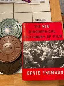 lot 77 image: Dictionary of Film Book and old reel home movies in cases (3)