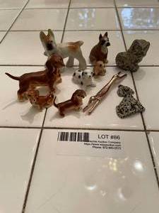 lot 86 image: PorcelainMetalStone dog Figurines