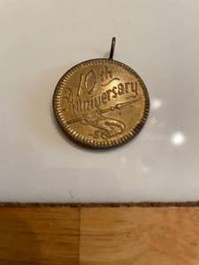 lot 115 image: 10th Anniversary SRF Coin made into a pendant&nbsp