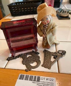 lot 122 image: Antique glass upright piano music box(1912), metal Bourbon and Vodka Bottle Hang Labels, &amp tramp soft mold figurine