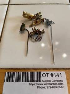 lot 141 image: Vintage tie pens depicting animals - turtle, sparrow, spider, and Charlie the Tuna
