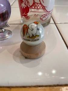 lot 144 image: Cartoon Character Foghorn Leghorn Juice Glass &amp painted marble on base with etched glass Earth Globe wstand.