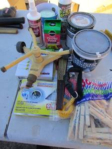 lot 41 image: Pre-mixed concrete patch, clothes pins, water sprinkler. Oder eliminator for drains, flex seal opened caulking