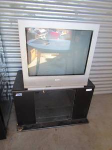 lot 49 image: 27Sanyo older TV (unknown working condition)21x35x19 glass front TV stand