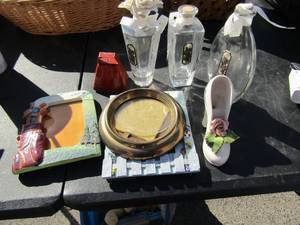 lot 108 image: High heel shoe dcor, 2 photo frames 4x7 orange cow bell and lots of perfume bottles