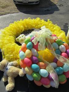 lot 118 image: Yellow wreath with H in the middle and Easter egg wreath with teddy bear