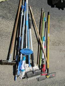 lot 202 image: Mops, brooms, paint sticks, and more