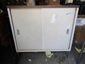 lot 205 image: Metal tool cabinet with front sliding doors, 3 shelves inside, some tools included 35x36 x14