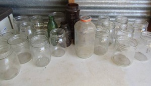lot 214 image: Large lot- mason jars, Vita OJ bottle and We Squeeze green glass bottle