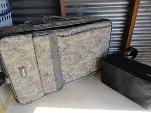 lot 217 image: CD holder black and Galleria rolling floral suit case