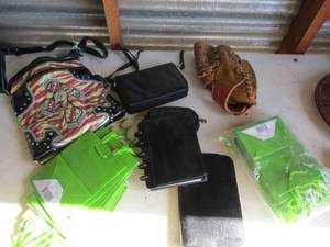 lot 219 image: NEW gift bags (over 20 pieces), cross purse, pocket books Spalding glove right hand