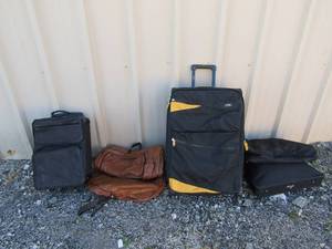 lot 299 image: 2 Lucas rolling suitcases and leather hanging bag plus black hanging bag