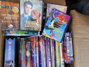 lot 302 image: Large box of VHS Disney movies and some DVD Disney movies