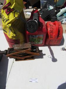 lot 335 image: Opened high yield bug treatment for garden 2 gas cans and car jack
