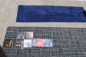 lot 176 image: HallwayBathroom Rugs (Gray one is 24 x 72) and Blues CDs (Stevie Ray Vaughan is unopened, Jonny Lang is Signed, Grand Funk Railroad Collection)