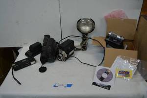 lot 15 image: Camera Lot Panasonic Palmcorder Video Recorder with Battery Charger, Vintage Bell & Howell Video Camera, Flash, DXG Digital Video Camera