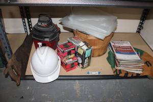 lot 244 image: Tools Hand Saw, Hard Hat, Small Shop-Vac no hose, Oil Filters, Security LightBird Seed, Handyman Magazines
