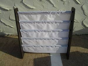 lot 99 image: BOOK STAND MADE WITH WOOD AND FABRIC SHELVING.&nbsp