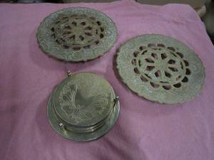 lot 108 image: BRASS HOT PLATES MADE IN JAPAN, BRASS COASTERS WITH HOLDER