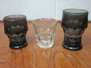 lot 58 image: BLACK GLASS DRINKWARE AND CLEAR SHOT GLASS MADE IN USA