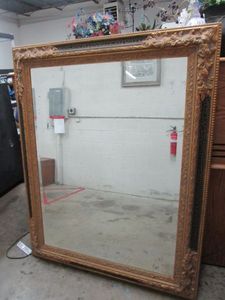 lot 39 image: LARGE ORNATE WALL HANGING MIRROR GOLD COLOR FLORAL TRIM WBLACK CRACKLE DESIGN