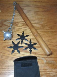 lot 8 image: MIDEAVIL FLAIL, SET OF 3 STAINLESS STEEL THROWING STARS W CARRYING POUCH LABELED KOHGA NINJA