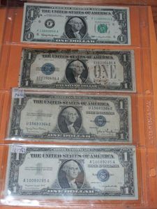 lot 145 image: (1) 1928 A $1 SILVER BANKNOTE, (1) 1935 D $1 SILVER BANKNOTE, (1) 1957 A $1 SILVER BANKNOTE, (1) 1963 $1 BANKNOTE