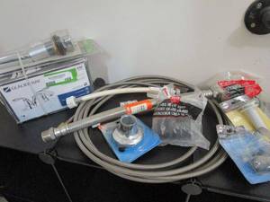 lot 169 image: GLACIER BAY FAUCET IN BOX, HOSES, &amp PLUMBING ACCESSORIES