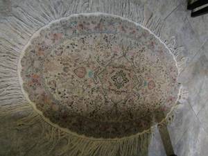 lot 17 image: SILK RUG OVAL 48 BY 33  HAS DAMAGE