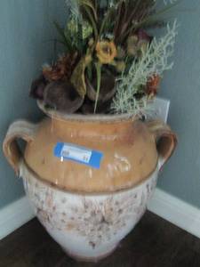 lot 84 image: TERRA COTTA POTTERY VASE WITH FLORAL DCOR 19H  TOTAL HEIGHT WFLOWERS 38 INCHES 17 WIDTH