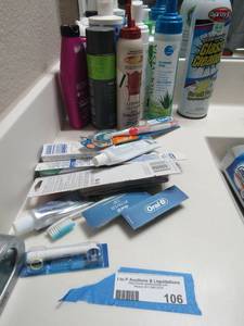 lot 106 image: NEW ORAL B TOOTH BRUSH,  ITEMS USED LOTION SANITIZER AND MORE