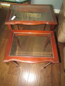 lot 136 image: 2 NESTING TABLES GLASS TOP WOOD FRAME LG 22H24W16D SM 211914