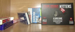 lot 142 image: EXPLODED KITTENS CARD GAME,  EXERCISE DICE. CARDS