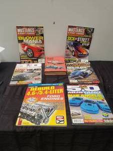 lot 42 image: Selection of Mustang magazines and Ford repair book