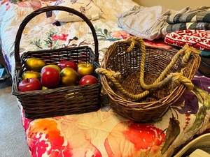 lot 299 image: Two Wicker Baskets With Faux Red, Green & gold Apples.