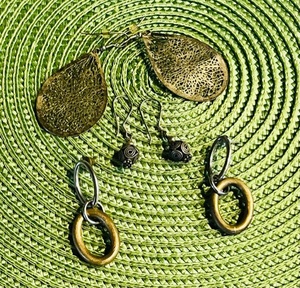 lot 425 image: Three Pairs Of Brass Earrings