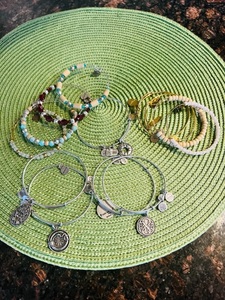 lot 431 image: 13 Alex & Annie Silver & Gold Bracelets