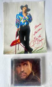 lot 66 image: Garth Brooks Autographed 8x10 photo and Ultimate Hits, Special Limited Edition Box set