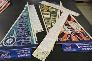 lot 263 image: Seattle Mariners, San Diego Padres, Oakland Athletics Pennants and Various Decals