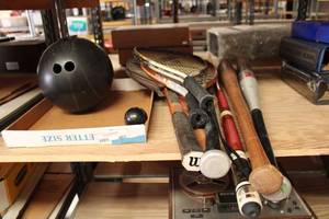 lot 401 image: Sports Lot Bowling Ball, Tennis and Racquetball Rackets, Pool Cue, and Baseball Bats (Including a Louisville Slugger